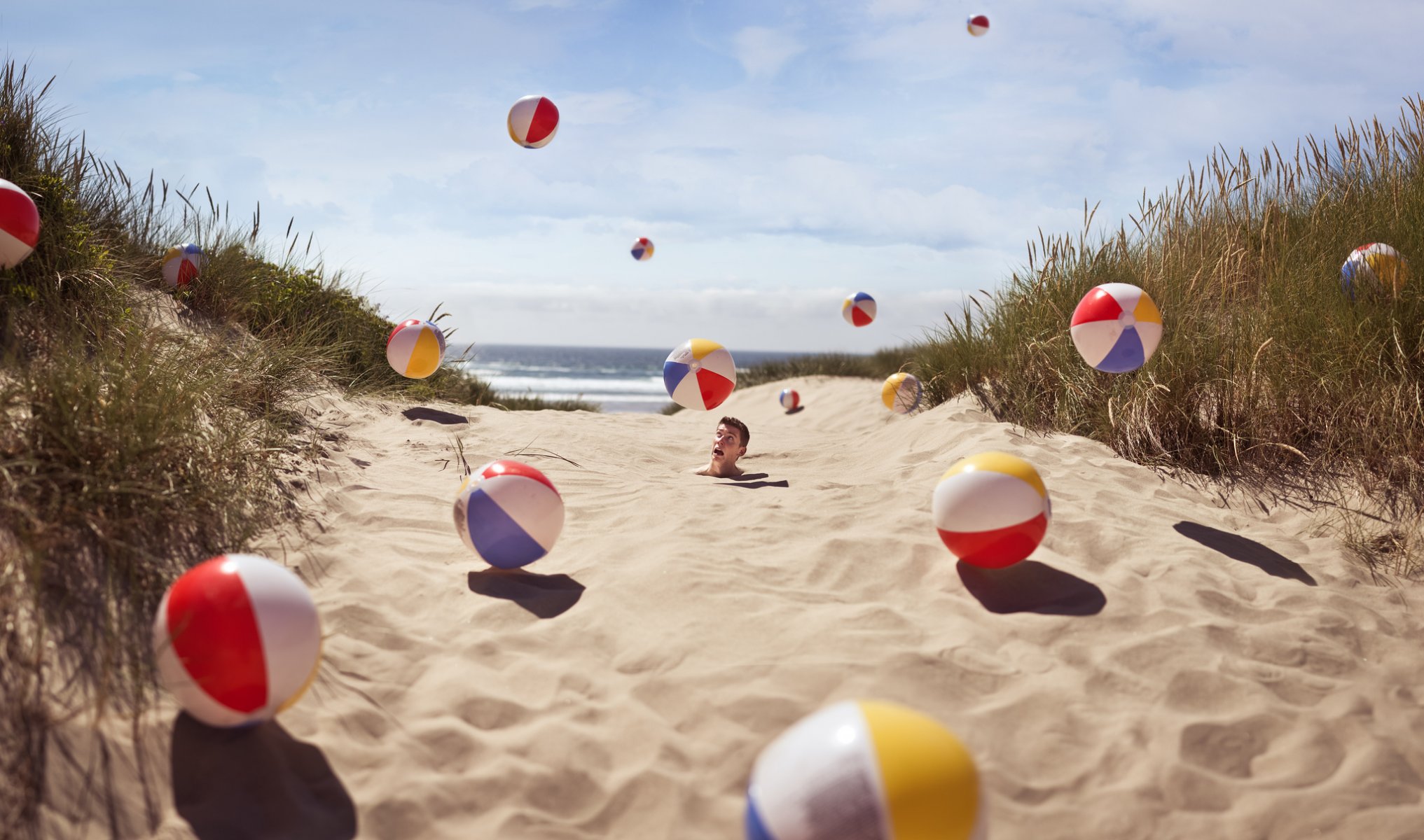 beach guy in the sand balls sand gra