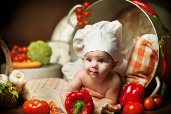 A little cook is lying in a saucepan