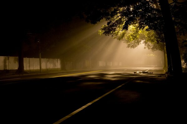 The night street is covered with fog