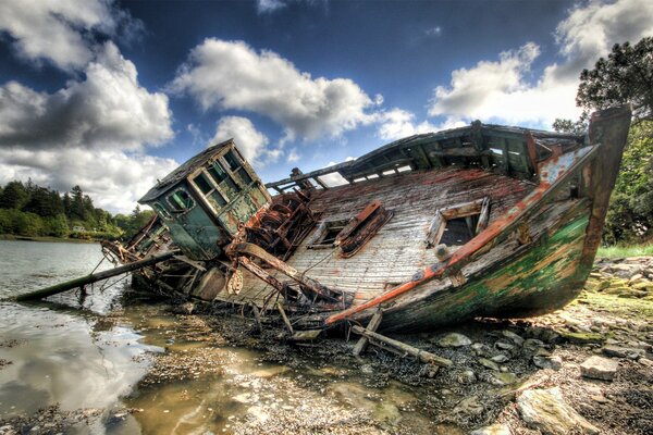 An old wrecked ship on the riverbank