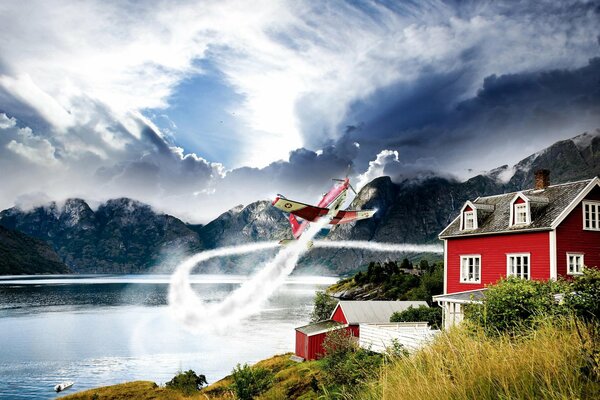 Avión en el cielo cerca de la casa y el lago