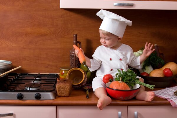 Servizio fotografico di un bambino piccolo come cuoco