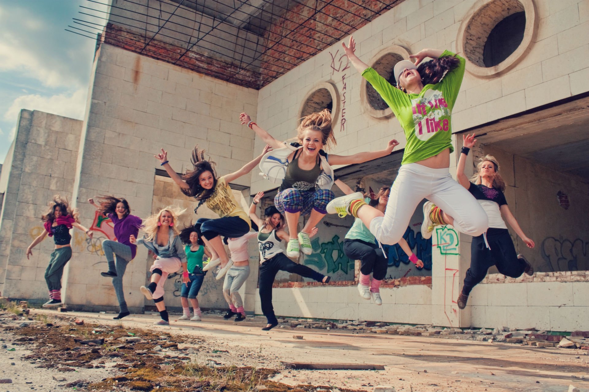 ituations people girl joy happiness jumping jumping in the air flying dancing movement action. street. background wallpaper