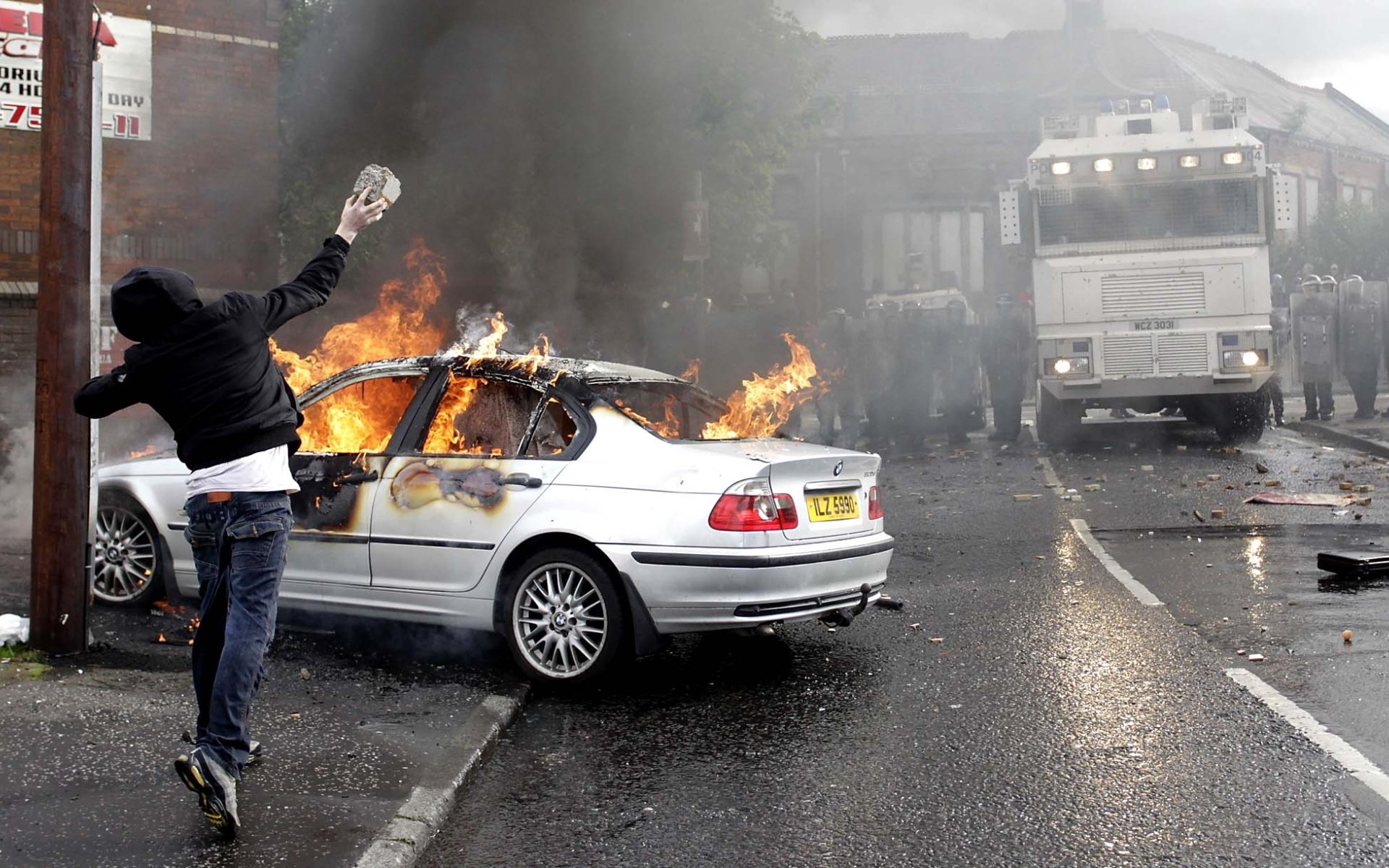 guy bully stone bmw on fire disturbances truck police situation