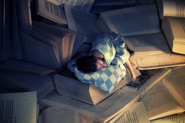 Wallpaper with a girl who sleeps on huge books