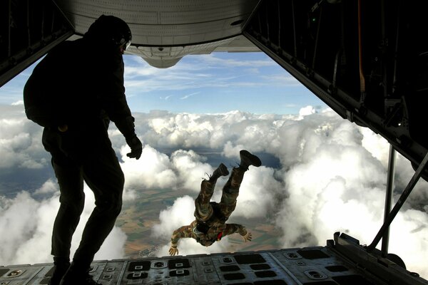 Jump from an airplane from a height into the clouds