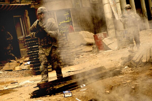 Army soldiers walk with weapons