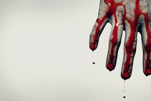 Gray background and a hand in blood