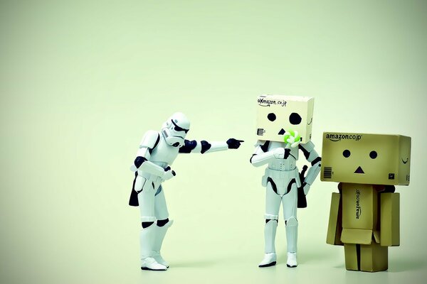Stormtroopers with cardboard boxes and a little man