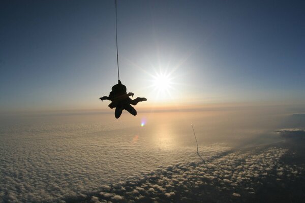 Jump with rarashut above fluffy clouds