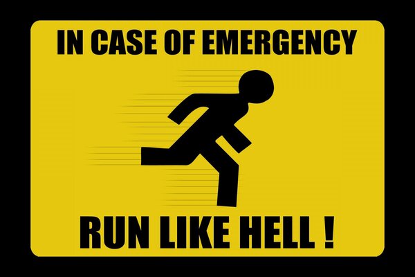 A sign of a running black man on a yellow background and a warning in English what to do in case of danger
