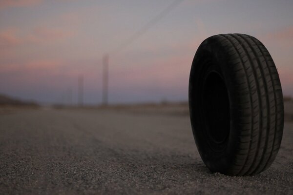 Sunset and a wheel near the road