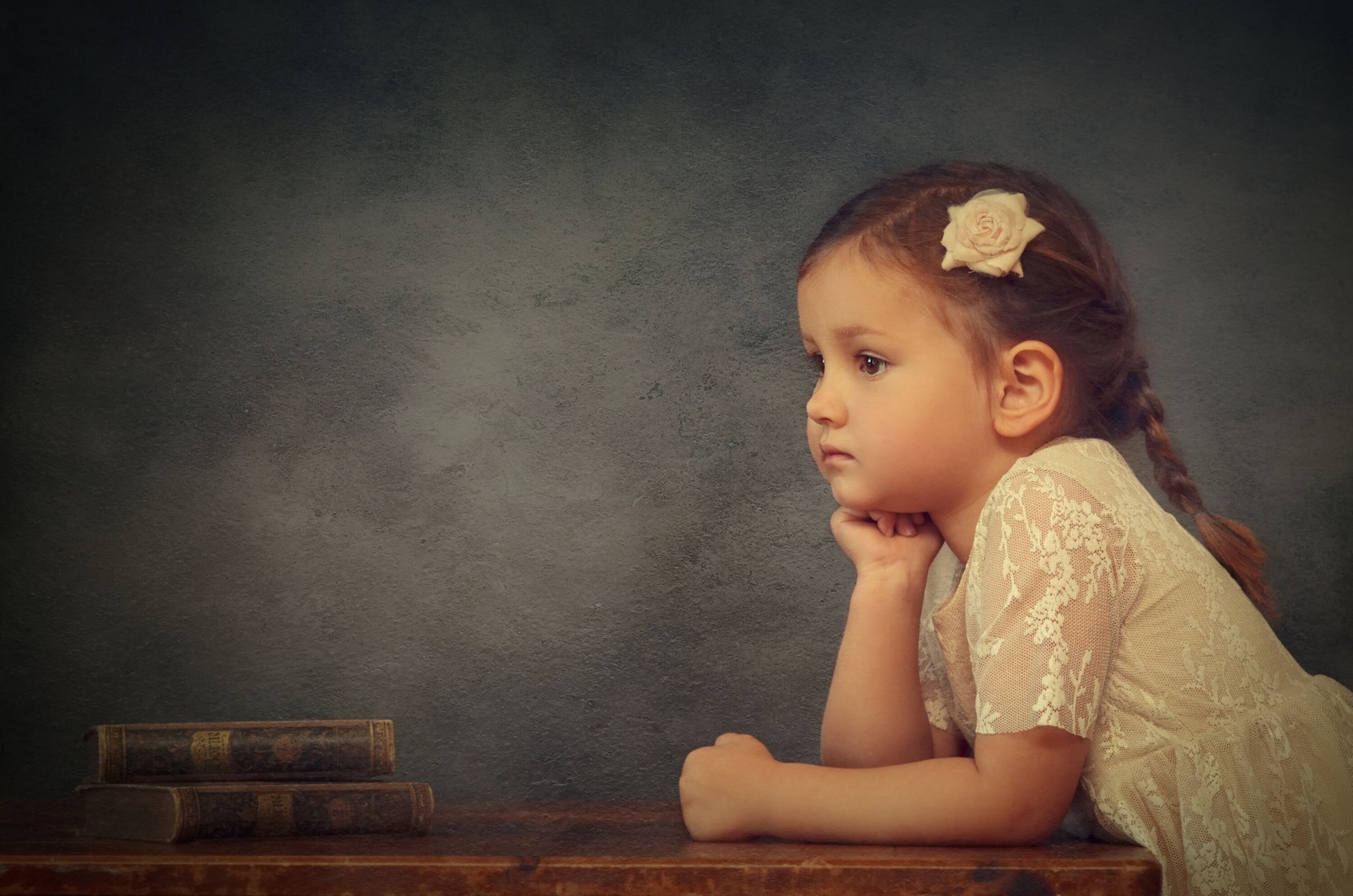 girl books rosette thoughtful mood