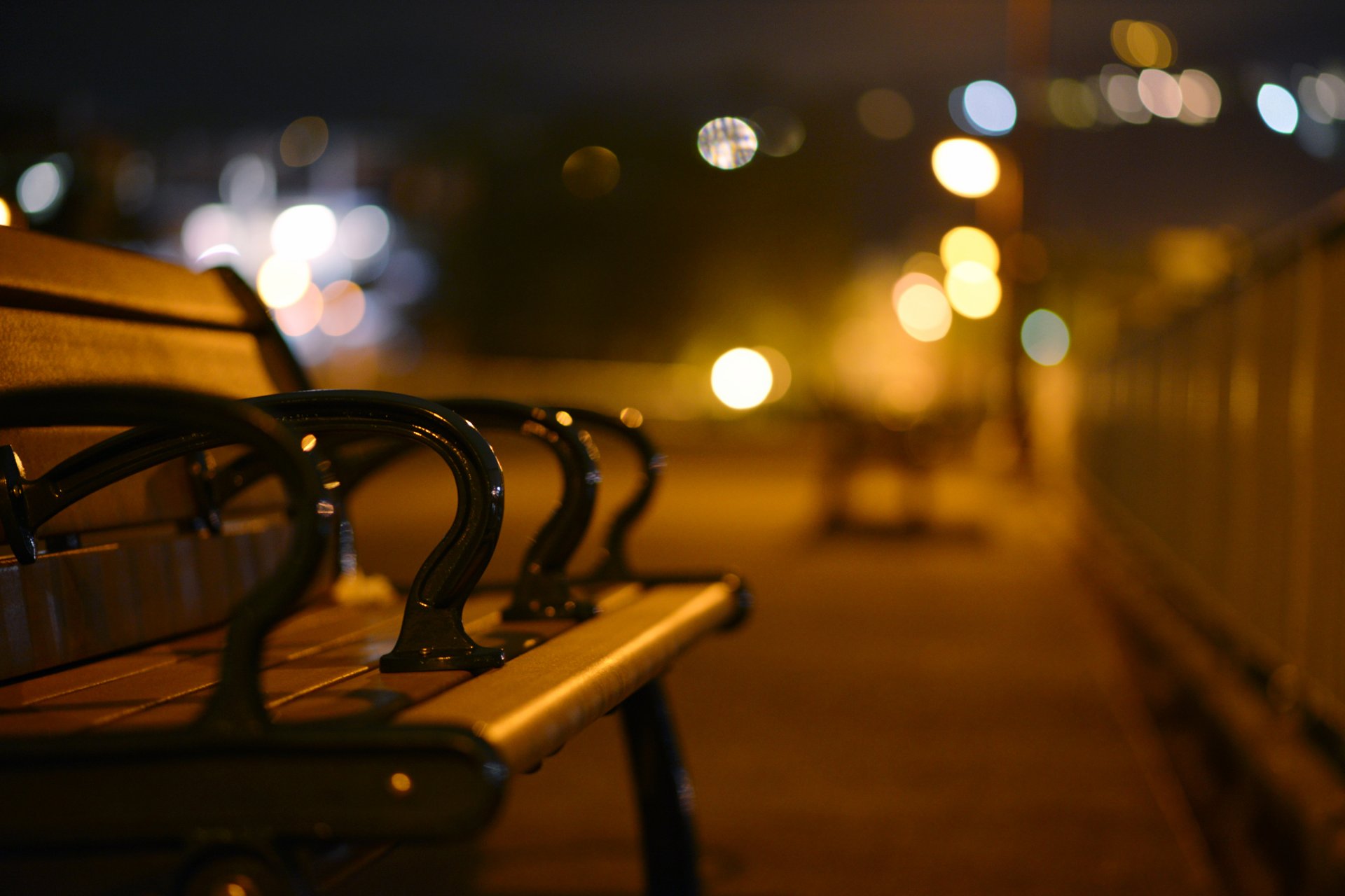 bench bench street city evening night lights bokeh blur