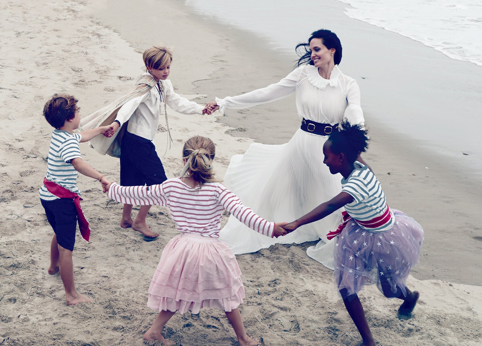 angelina jolie actress brunette white dress children fun dance sea sand beach vogue 2015 annie leibovitz