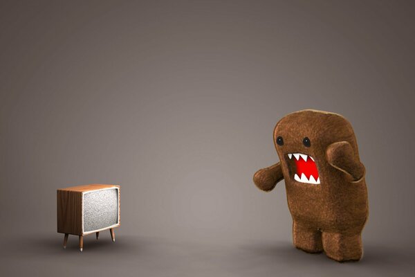 A brown toy screaming at the TV