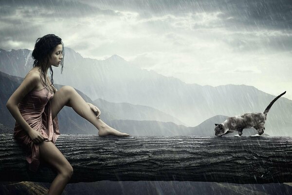 A girl and a cat are sitting in the rain on a tree trunk