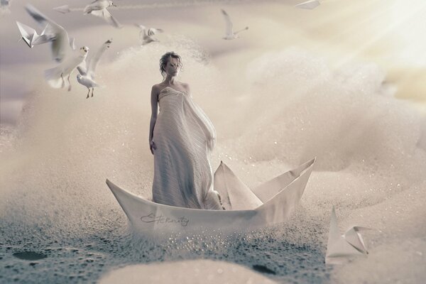 Foto creativa de una niña en un barco de papel