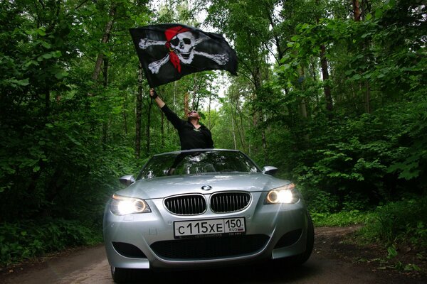 A man waves a pirate flag