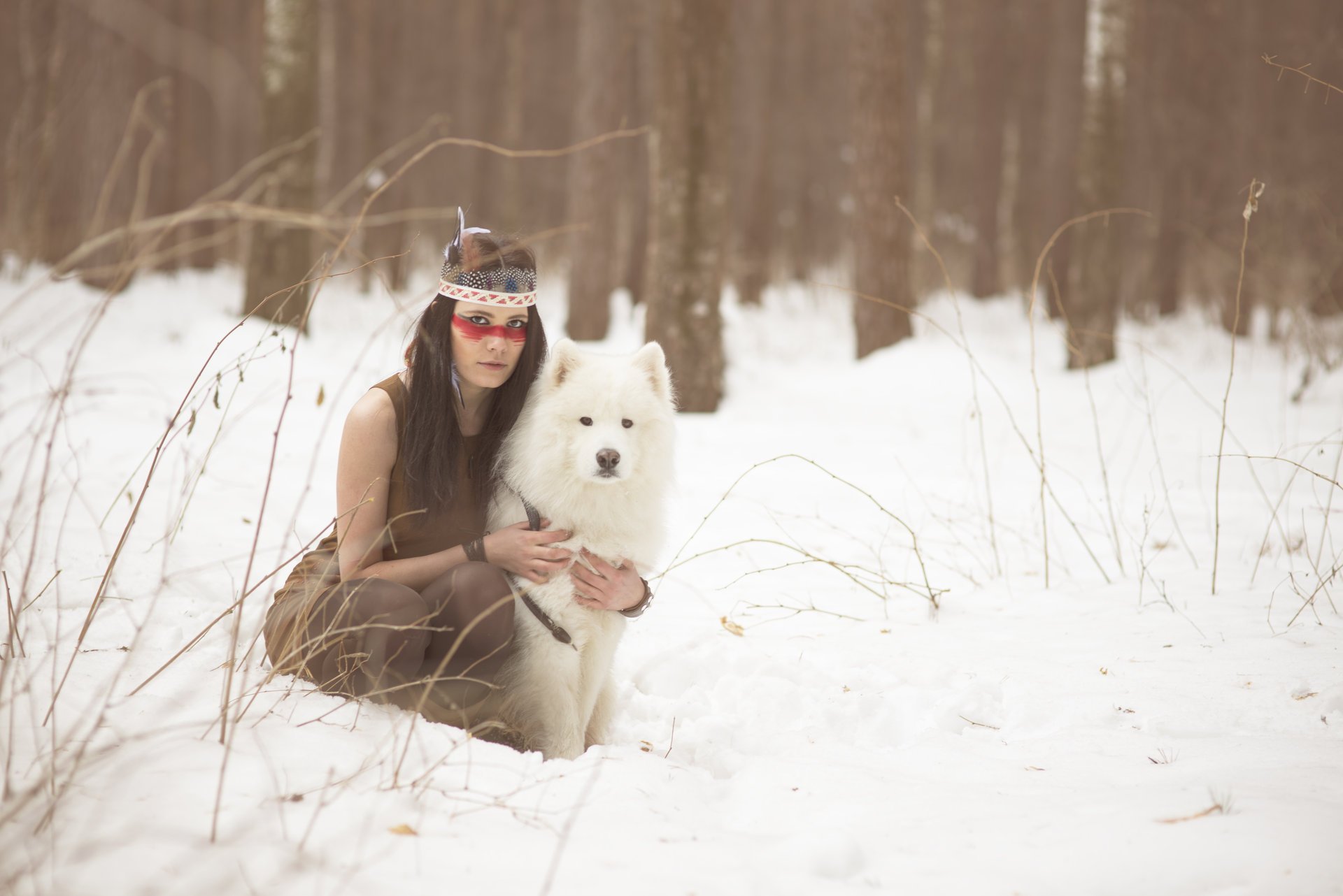 girl brunette face hair paint feathers winter snow dog view other