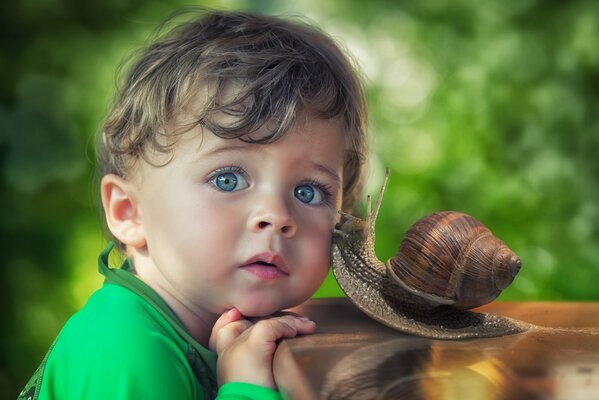 Snail kissed a little boy