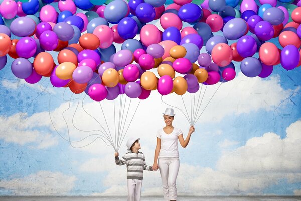 An idea for a photo shoot of a mother with a child. What could be more carefree than balloons against a blue sky?