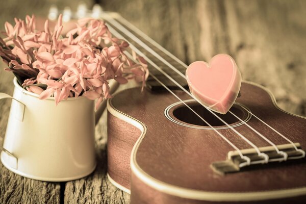 Guitarra y flores en estilo romántico