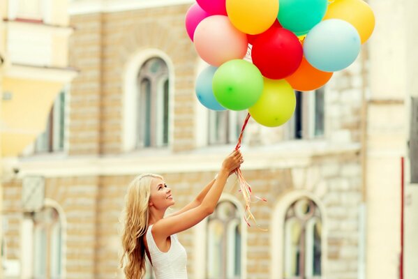 Happy girl with balloons