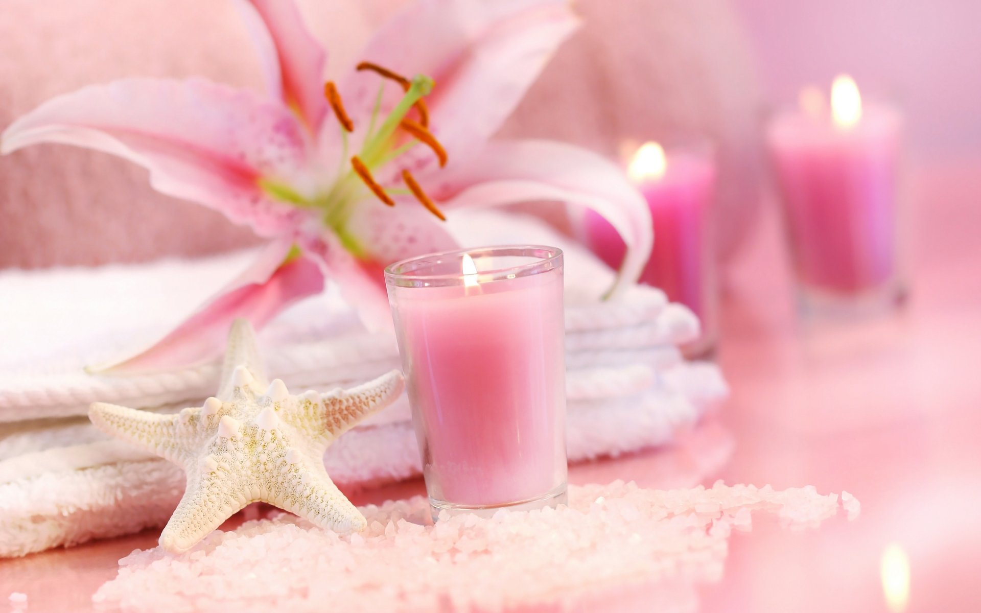 pirit contest spa flowers lily pink candles sea stars salt crystals towel gentle mood pink candle flame starfish