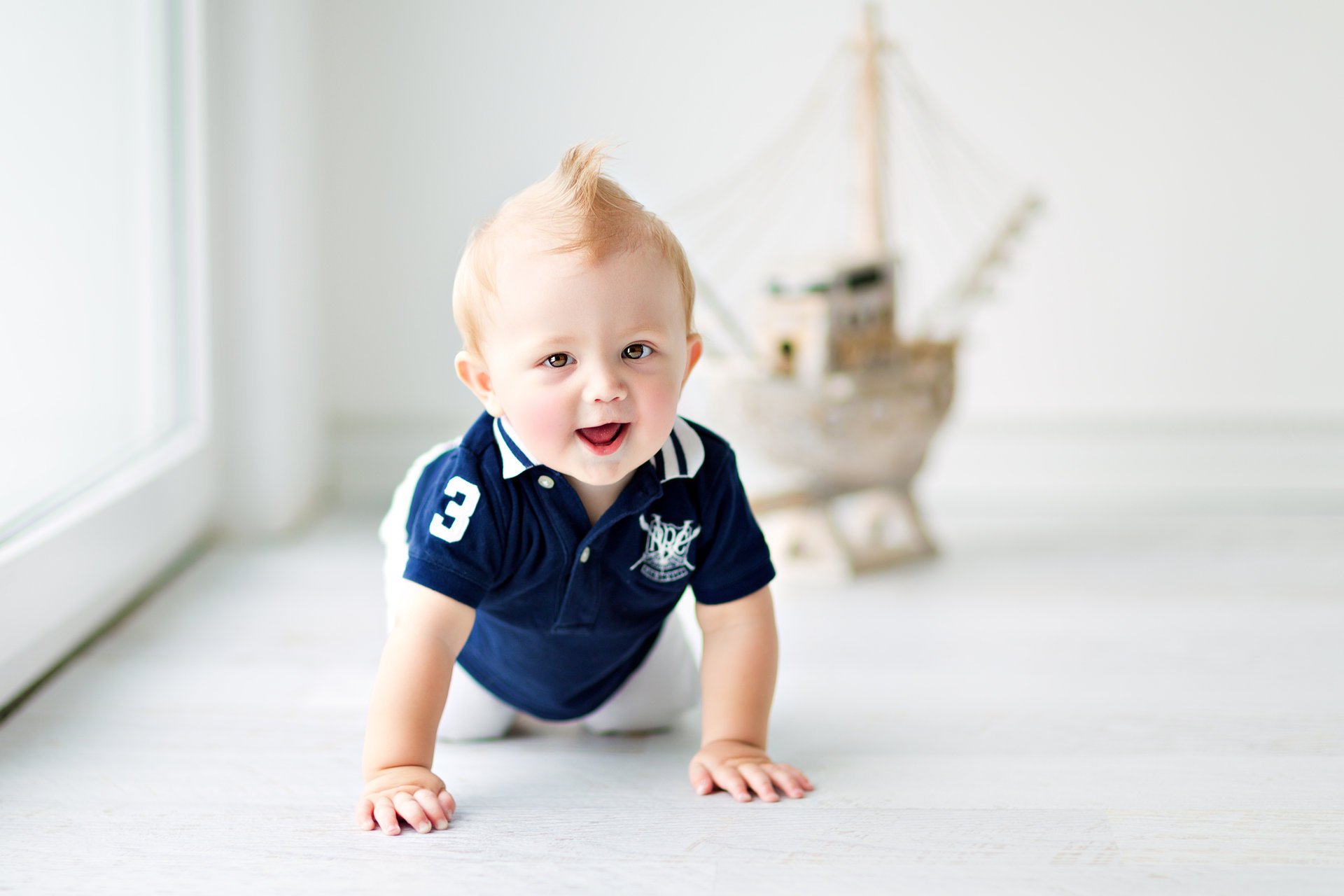 happy baby baby big beautiful blue eyes smile play baby enjoying life marine ship boy kid game kids enjoying life