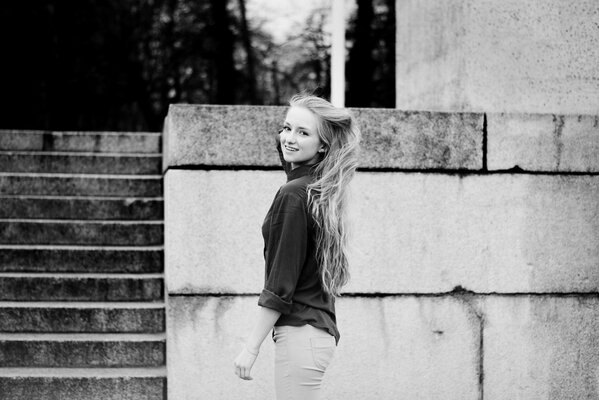 Black and white photo of a girl smiling