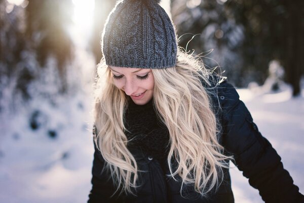 Beautiful girl in winter with freckles