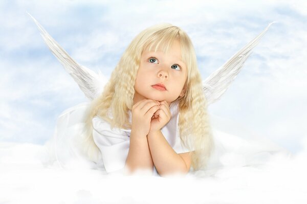 Angel girl with wings and blonde hair in