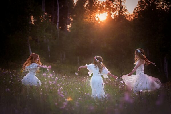 Dance of three girls in the forest