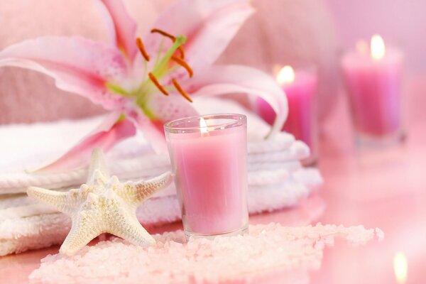 Pink candles and delicate lilies