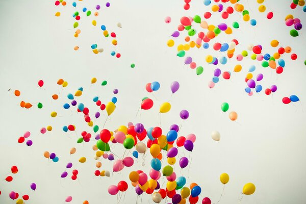 Colored balloons in flight