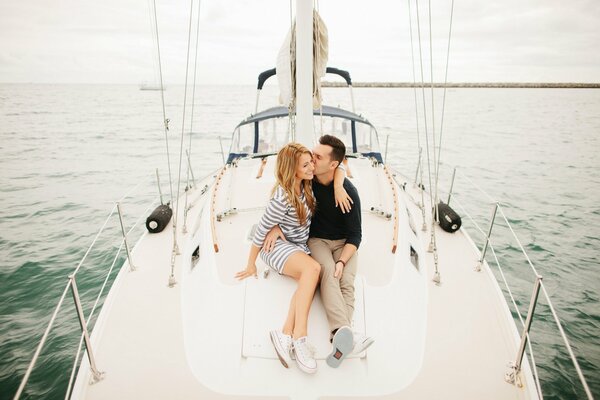 A couple of lovers on a yacht in a sporty classic style