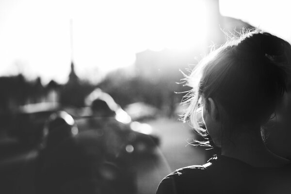 Black and white photo of a girl from the back