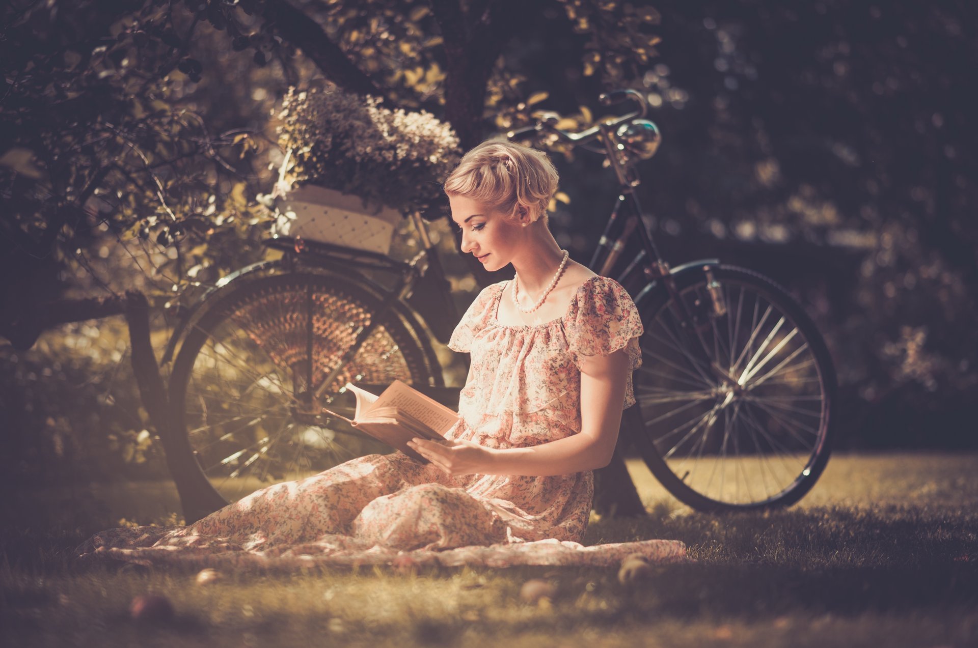 girl blonde dress beads style retro book reads grass bike shopping flower tree leaves nature