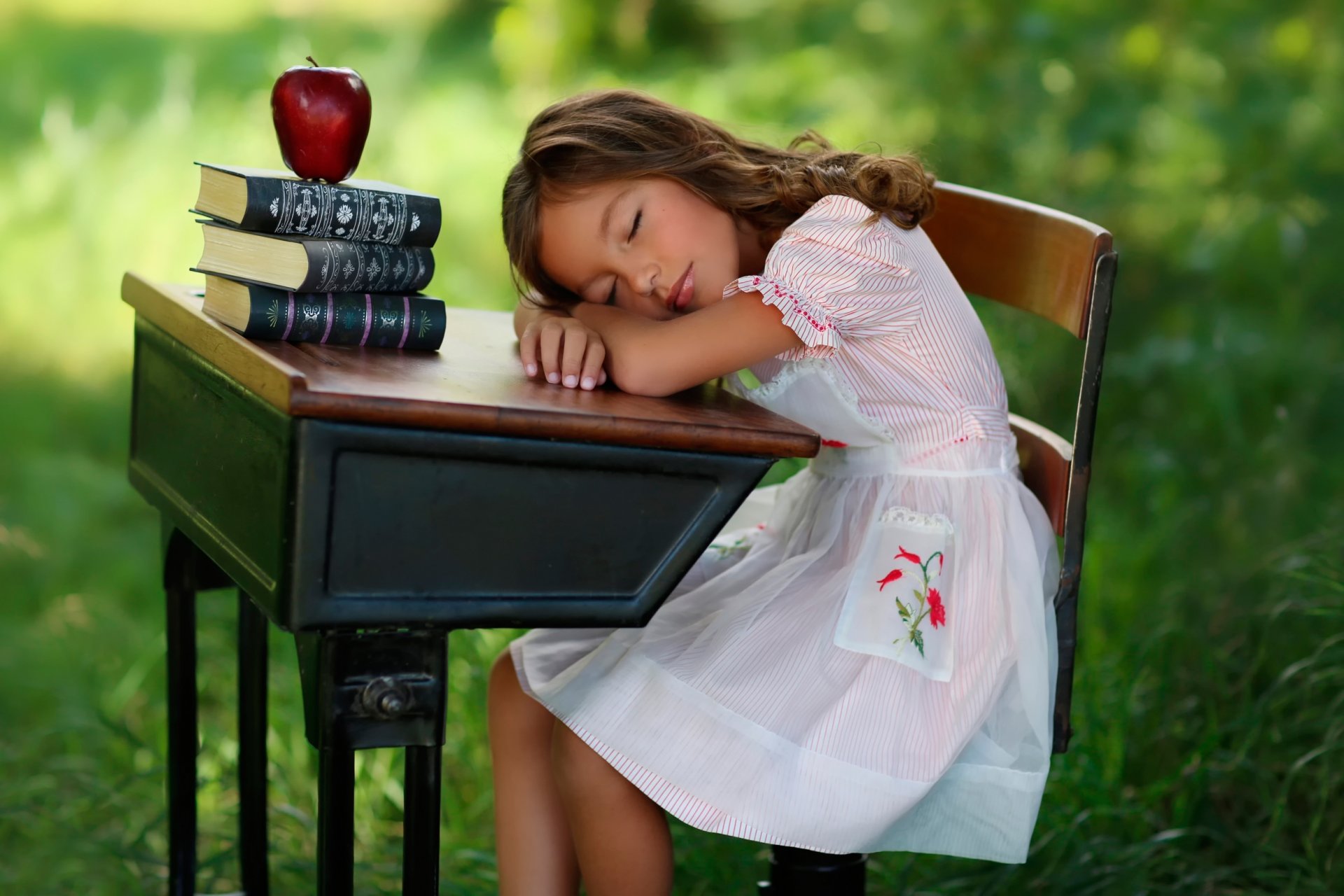 girl sleeping books apple