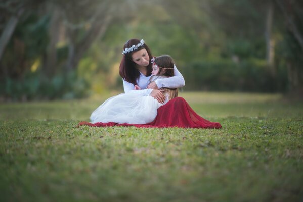 Mom and girl hug