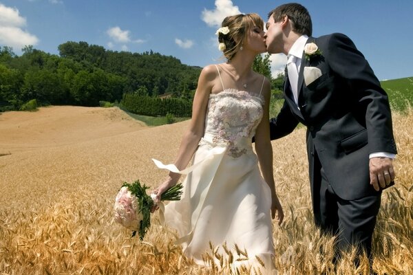 Tender photo of the newlyweds in the field