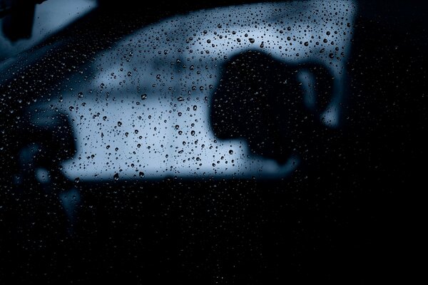 Silhouette of a girl in a car