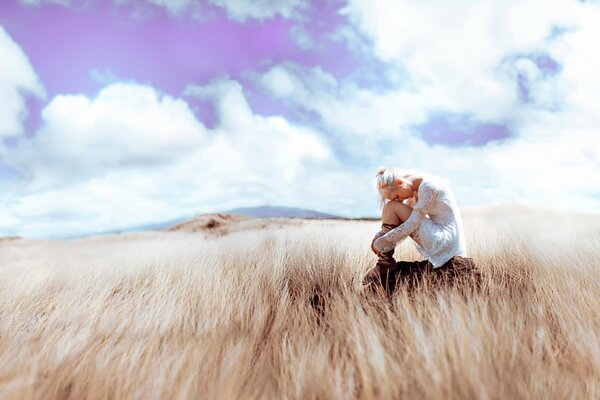 Girl and loneliness. Photos in the steppe