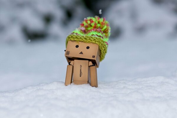 Box man in the snow in the cold