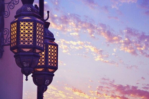 Two lanterns on the background of clouds