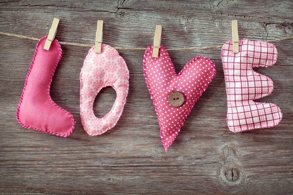 Letters love made of fabric on clothespins