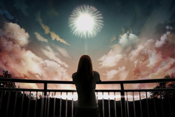 A girl watching fireworks in the sky