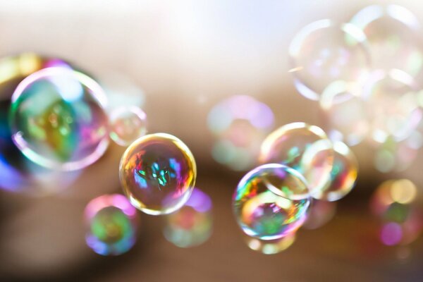 Beautiful soap bubbles reflect the sun