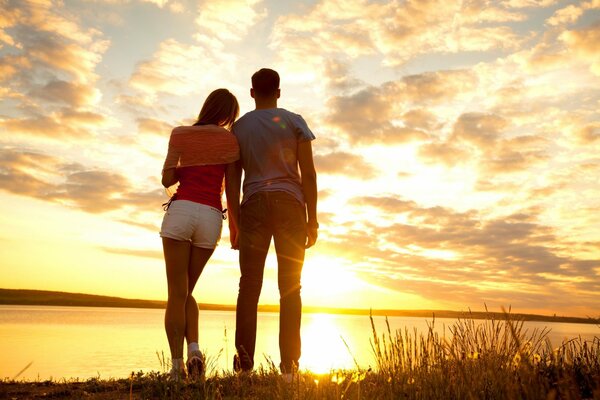 Guy and girl romance at sunset